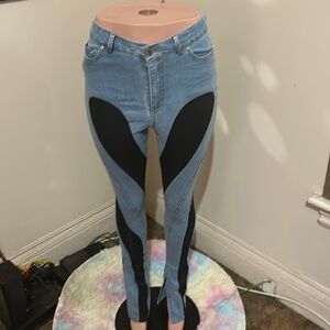 Denim and black jeans legs are run skinny